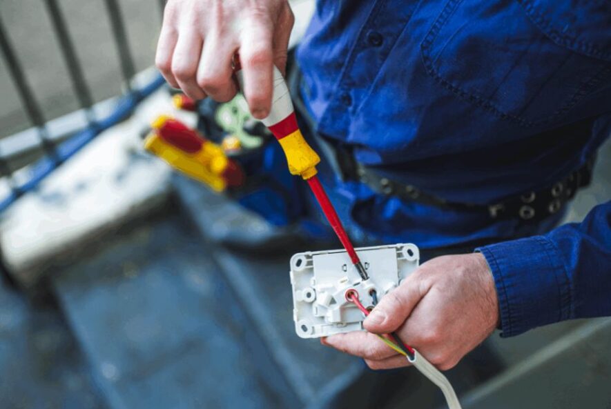 an emergency electrician fixing a switch in sydney