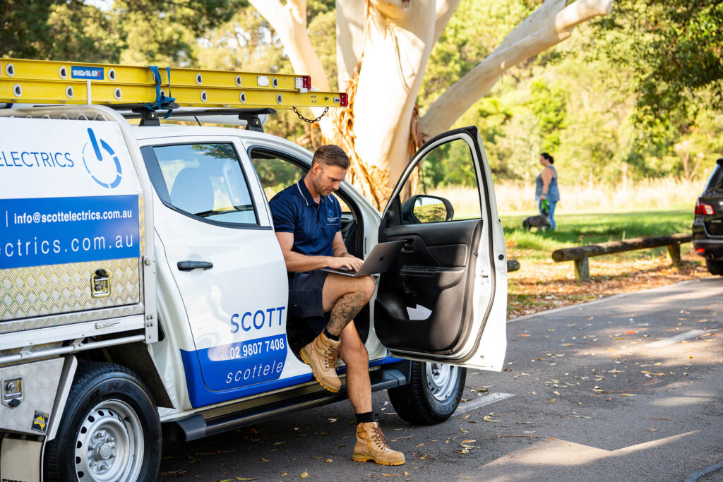 emergency electrician in a ute waiting for a client in sydney nsw